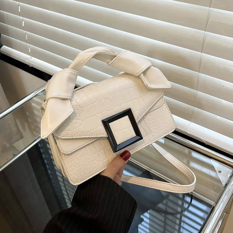 High-end handbag with trendy stone pattern