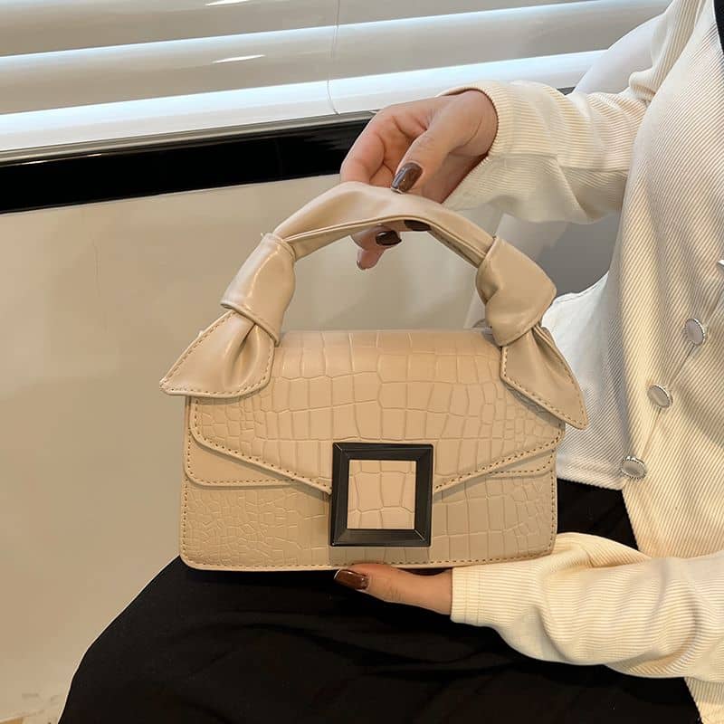 High-end handbag with trendy stone pattern