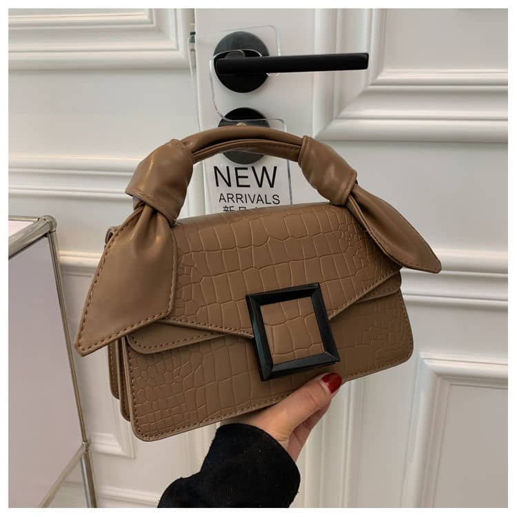 High-end handbag with trendy stone pattern