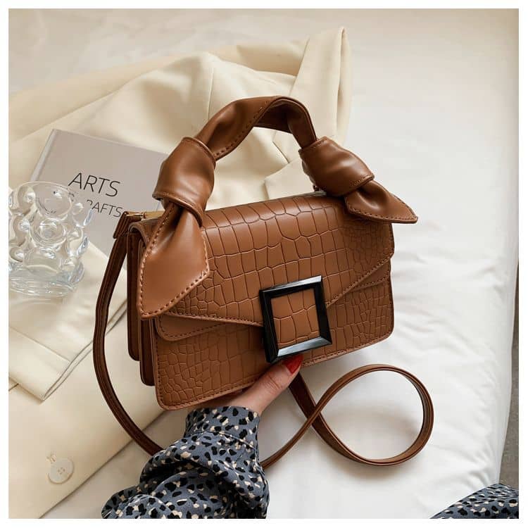 High-end handbag with trendy stone pattern