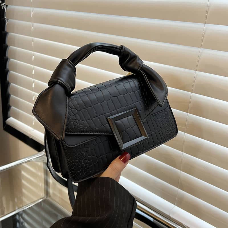 High-end handbag with trendy stone pattern